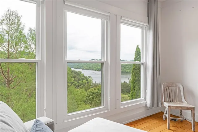 a room with pool table and chairs
