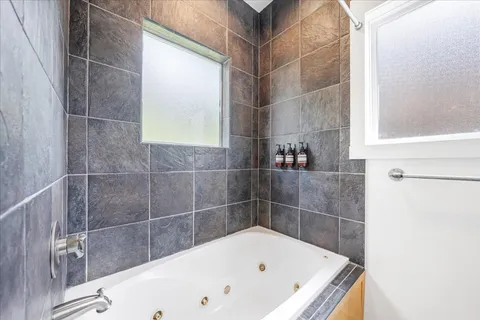 a bathroom with sinks and a mirror