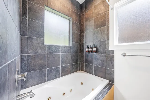 a bathroom with sinks and a mirror