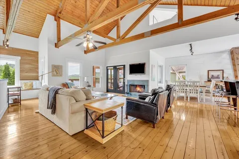 a living room with fireplace furniture and a flat screen tv