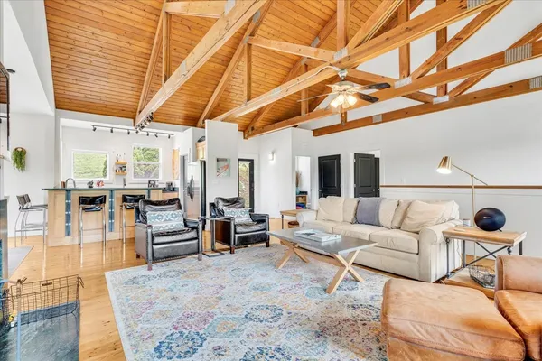 a view of a bedroom with furniture and a window