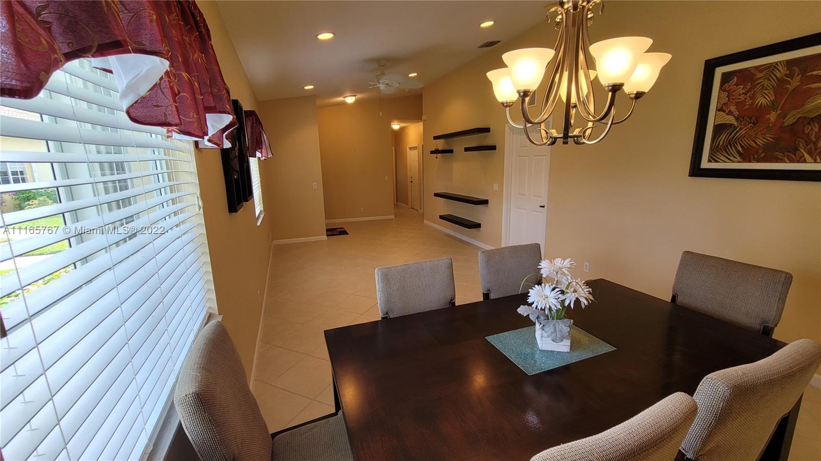 Baywinds West Palm Beach, FL 33411 - Photo 12 of 38 a view of a dining room with furniture and wooden floor