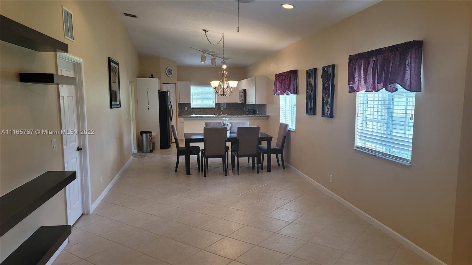 Baywinds West Palm Beach, FL 33411 - Photo 13 of 38 a view of a dining room with furniture