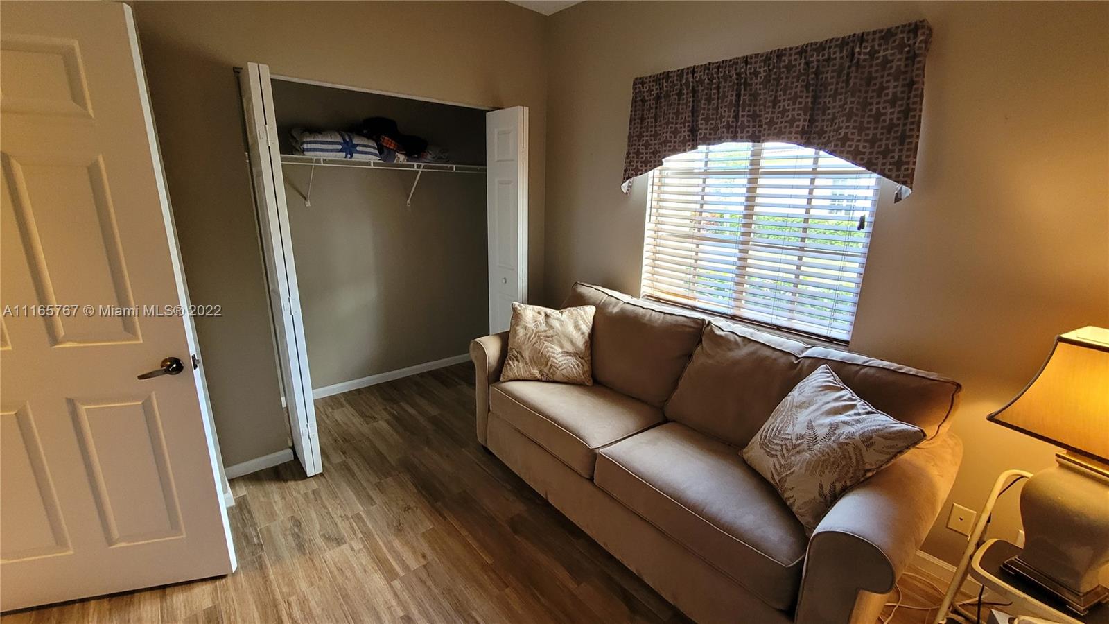 Baywinds West Palm Beach, FL 33411 - Photo 27 of 38 a living room with furniture and a window
