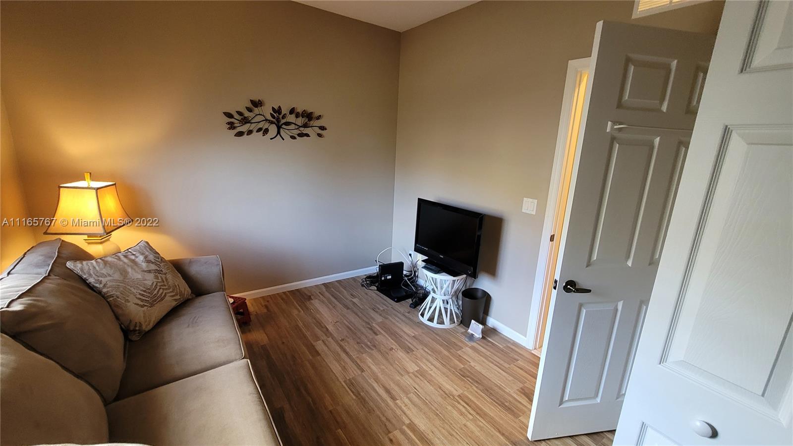 Baywinds West Palm Beach, FL 33411 - Photo 28 of 38 a bedroom with a bed and flat screen tv