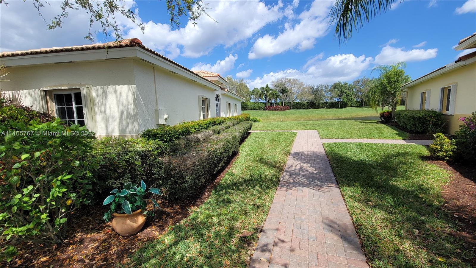 Baywinds West Palm Beach, FL 33411 - Photo 4 of 38 a view of a back yard of the house
