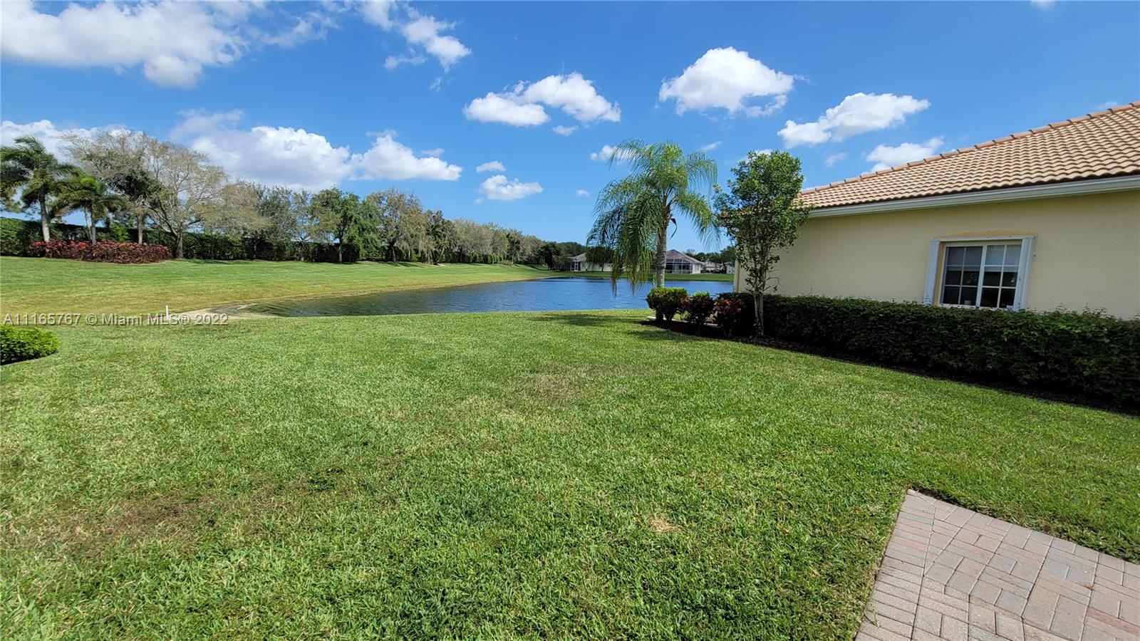 Baywinds West Palm Beach, FL 33411 - Photo 6 of 38 a view of a house with a backyard