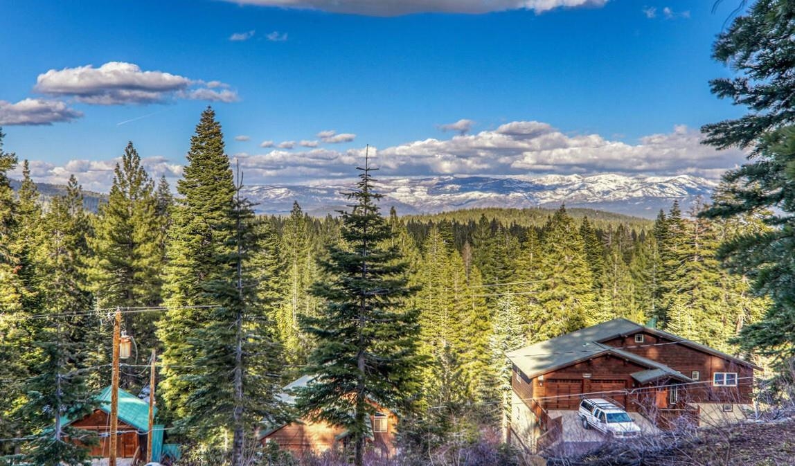 11910 Rhineland Avenue Truckee, CA 96161 - Photo 1 of 24 a view of a lake with a building in the background