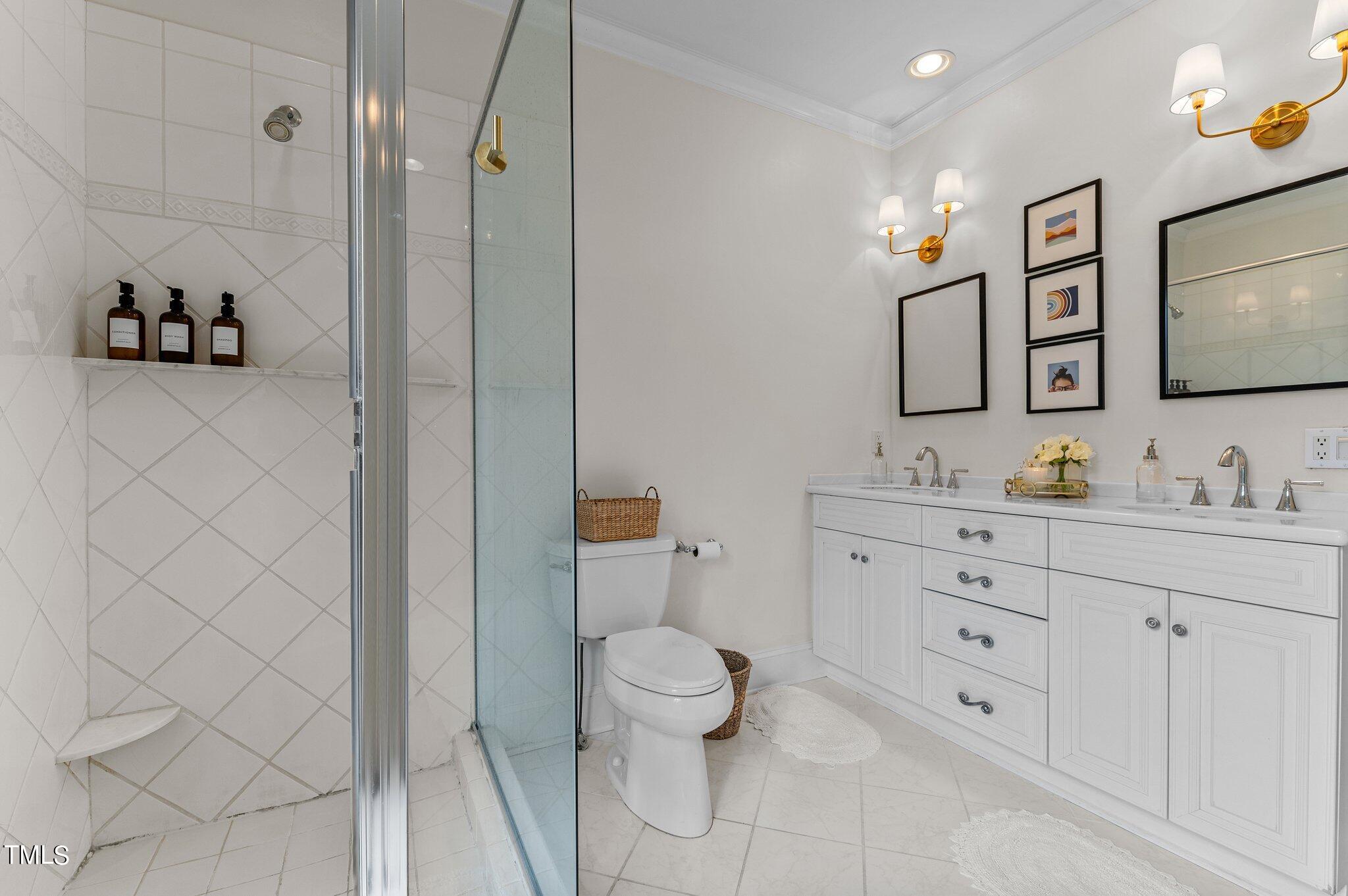 3000 Woodgreen Drive Raleigh, NC 27607 - Photo 22 of 55 a bathroom with a toilet sink and mirror