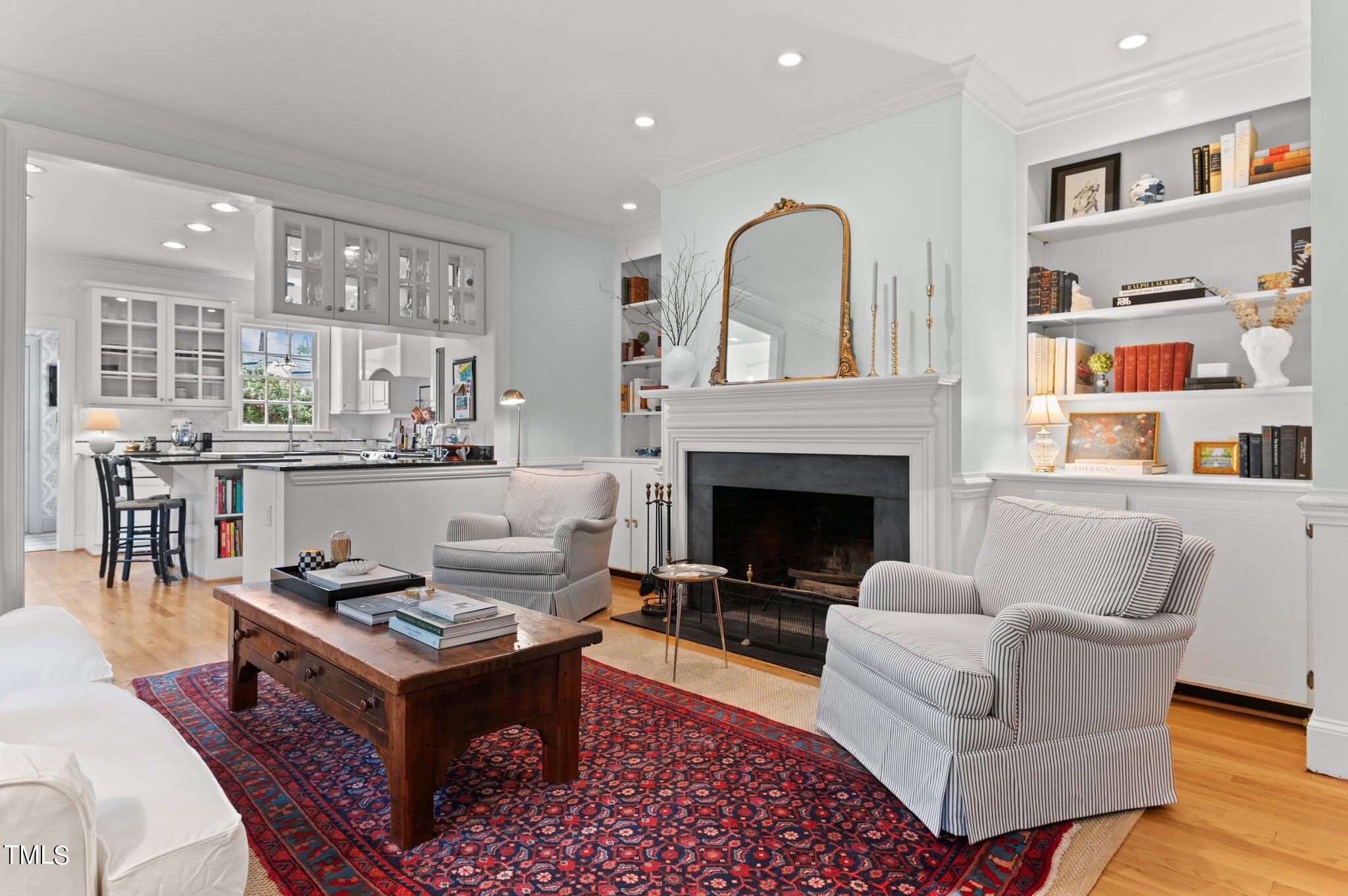 3000 Woodgreen Drive Raleigh, NC 27607 - Photo 27 of 55 a living room with furniture and a fireplace