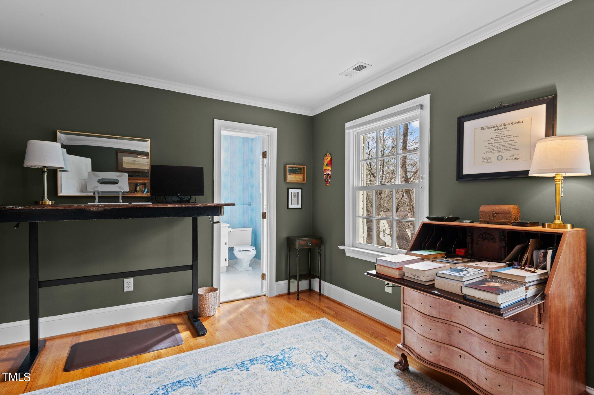 3000 Woodgreen Drive Raleigh, NC 27607 - Photo 36 of 55 a living room with a couch and a window