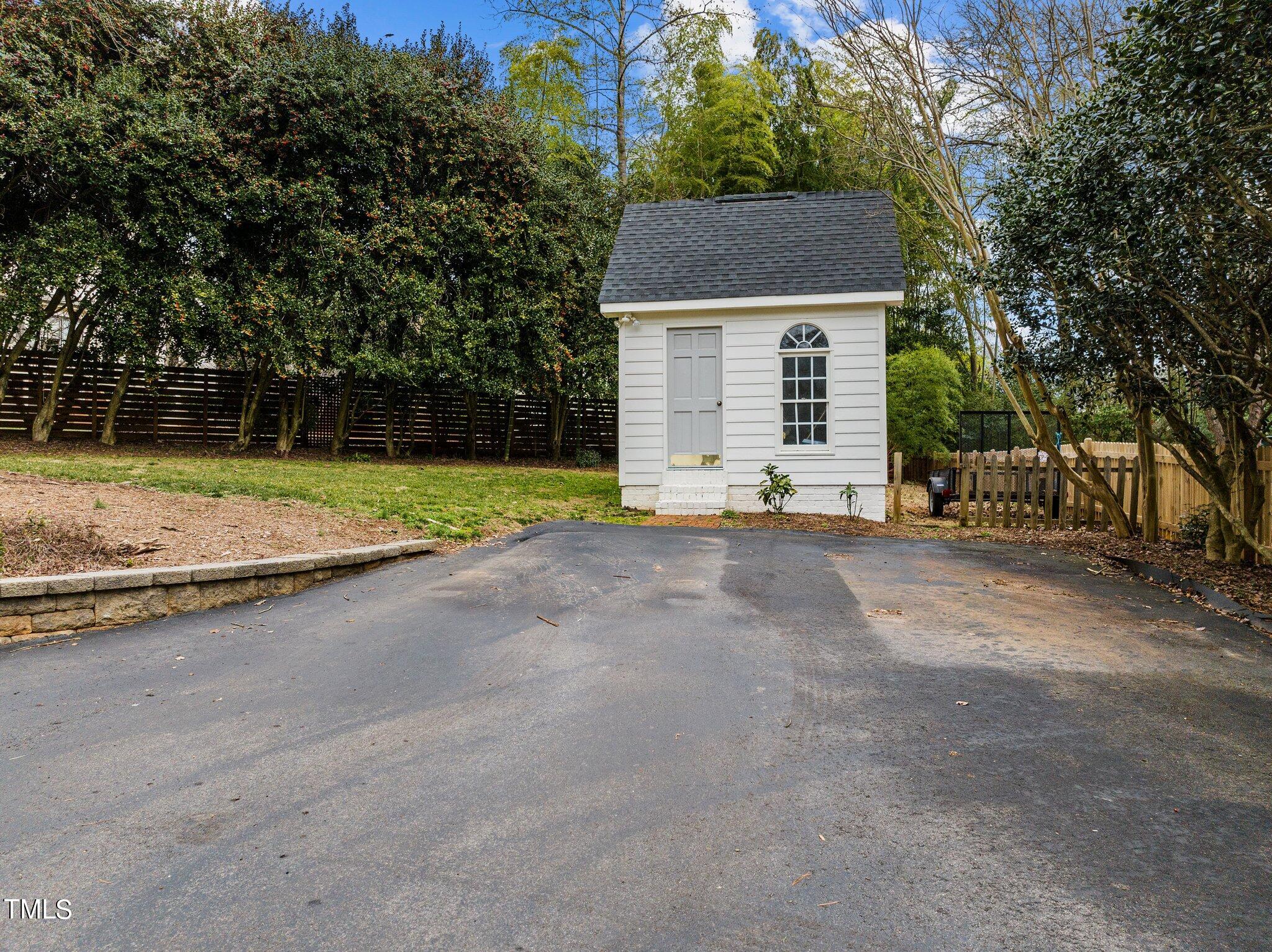 3000 Woodgreen Drive Raleigh, NC 27607 - Photo 51 of 55 a view of a house with a yard and garage