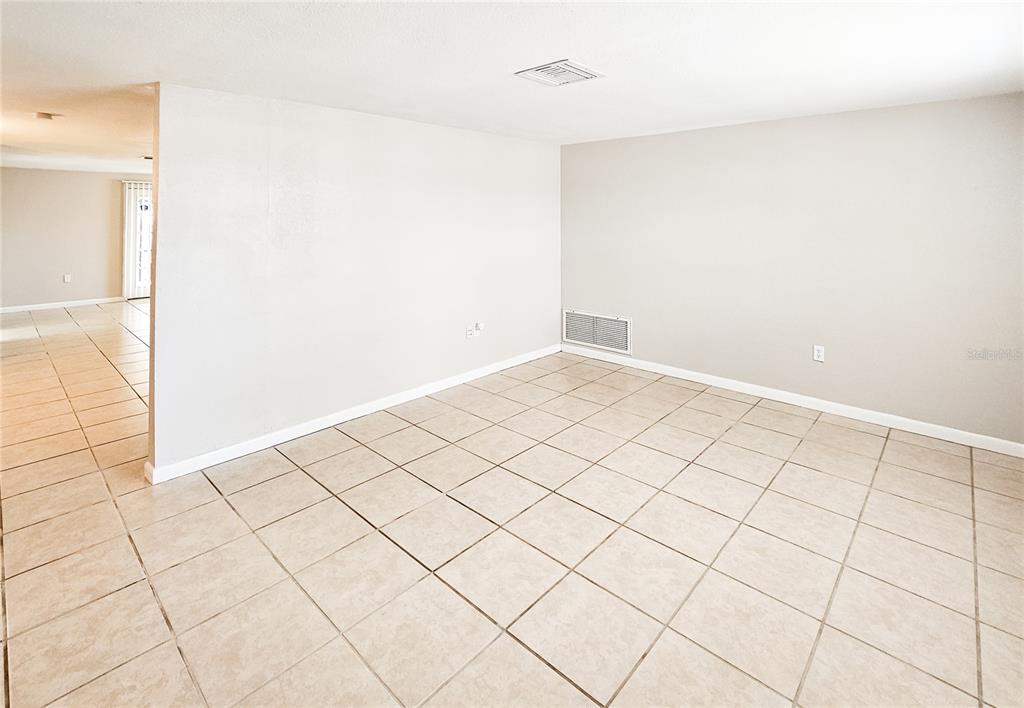7304 Embassy Boulevard Port Richey, FL 34668 - Photo 3 of 14 a view of an empty room