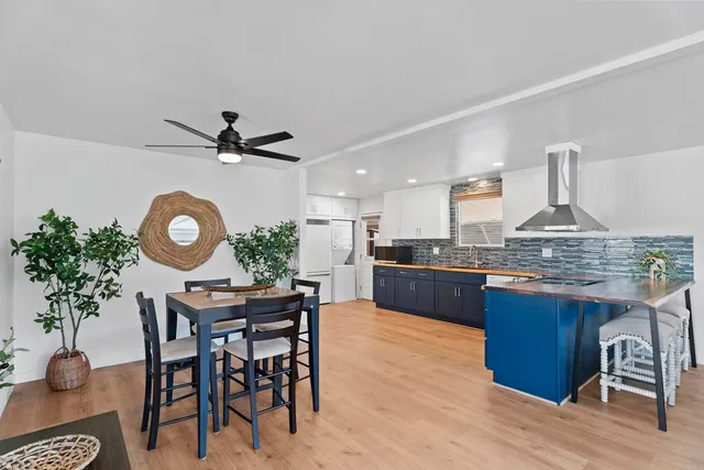 a kitchen with a table and chairs in it