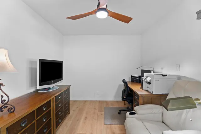 a bedroom with a workspace