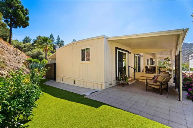 a view of backyard with seating area