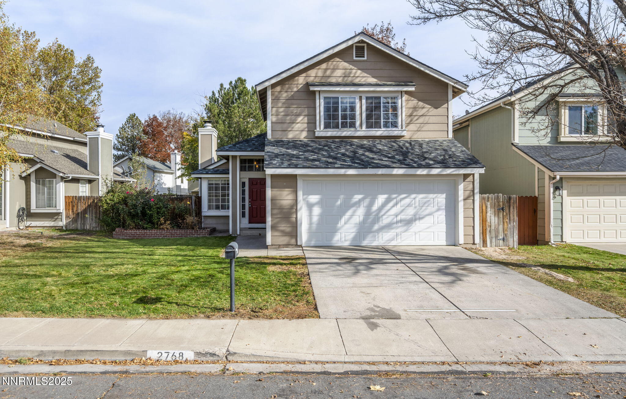 2768 Azuza Way Reno, NV 89502 - Photo 1 of 26 a front view of a house with a yard