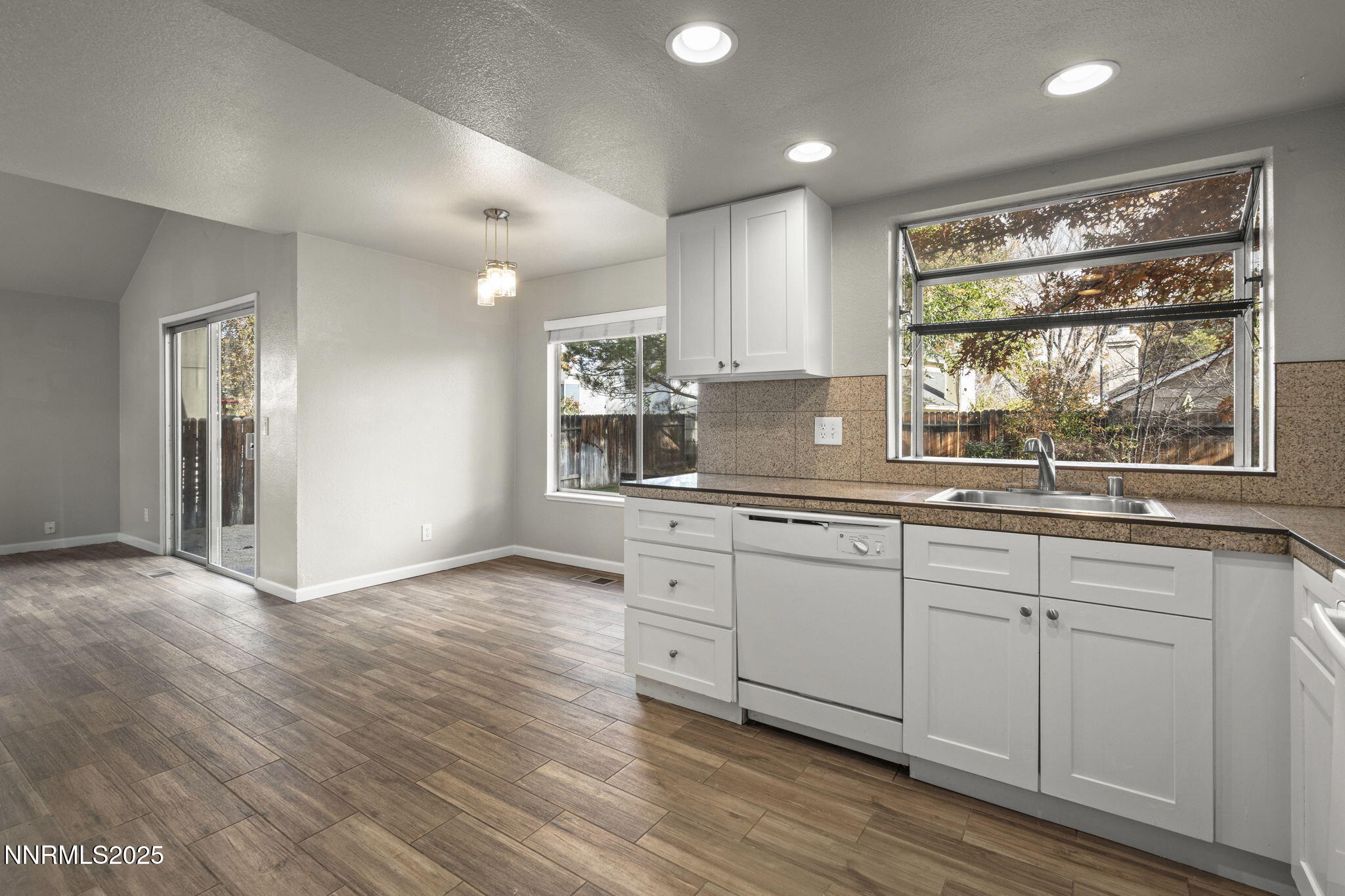 2768 Azuza Way Reno, NV 89502 - Photo 11 of 26 a kitchen with a sink wooden floor and window