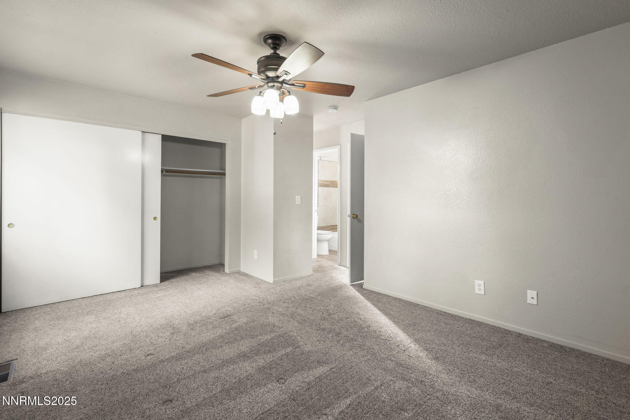 2768 Azuza Way Reno, NV 89502 - Photo 17 of 26 a view of an empty room with a fan