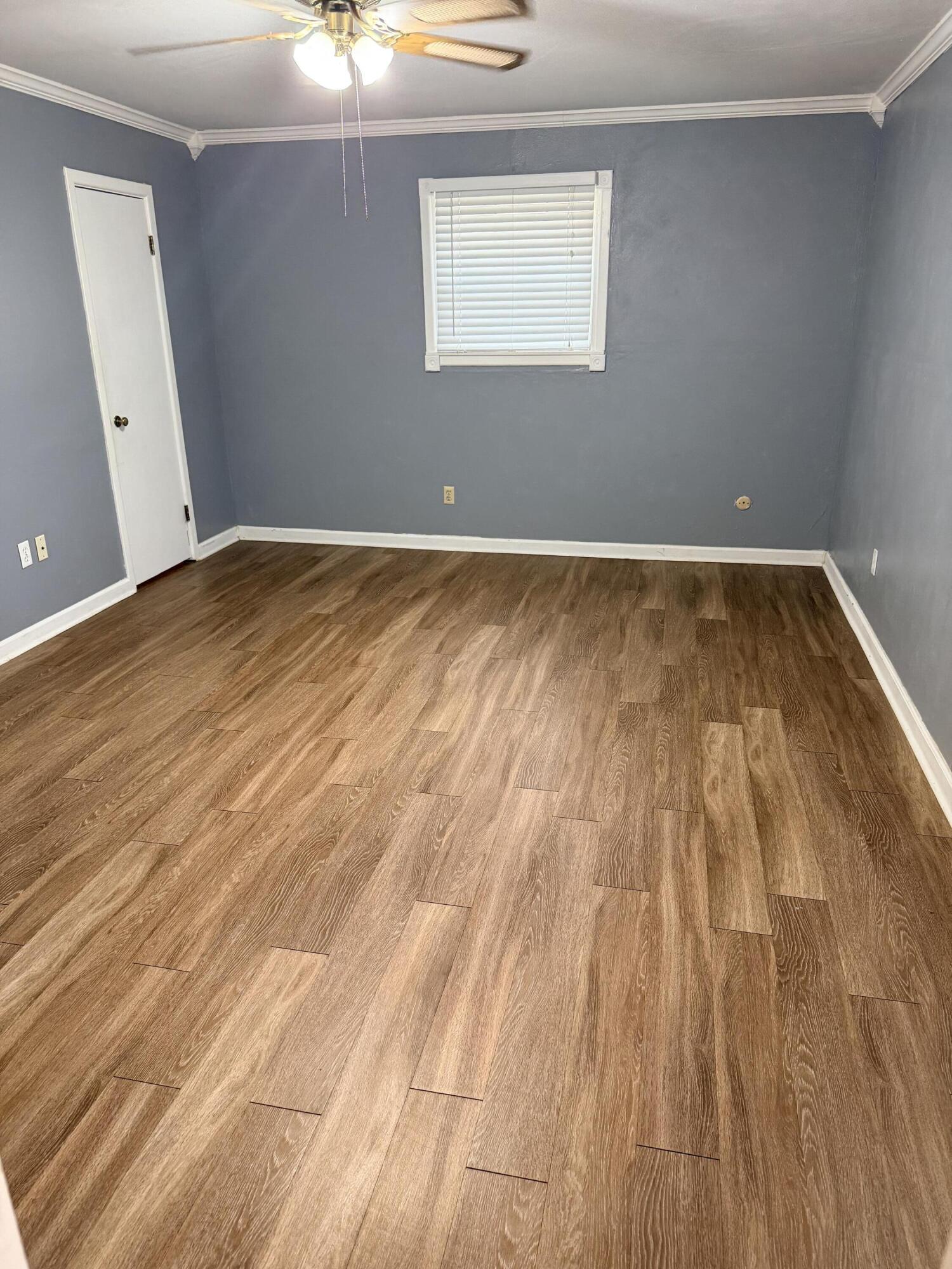3814 27th Street Lubbock, TX 79410 - Photo 13 of 24 wooden floor in a room