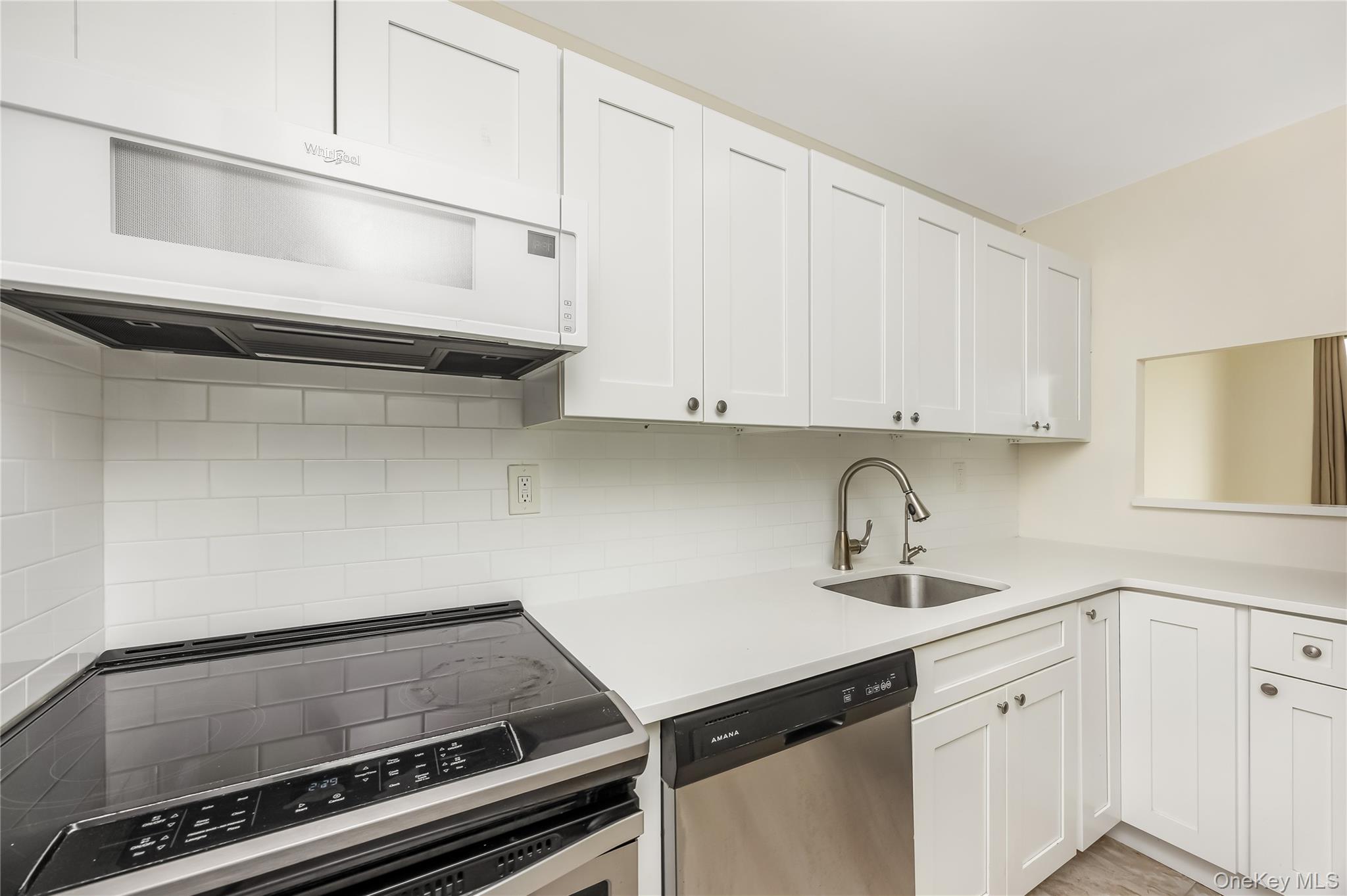 2 Richmond Road, Unit 6M Lido Beach, NY 11561 - Photo 13 of 21 a kitchen with a sink cabinets and appliances