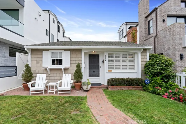 a view of a house with a backyard and a patio