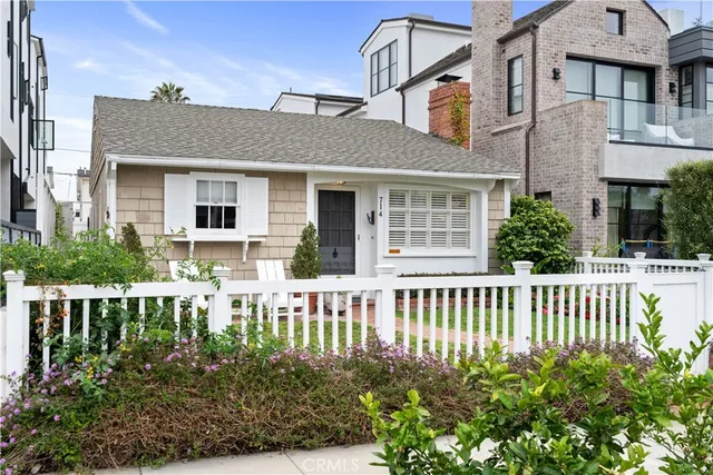 front view of a house with a garden