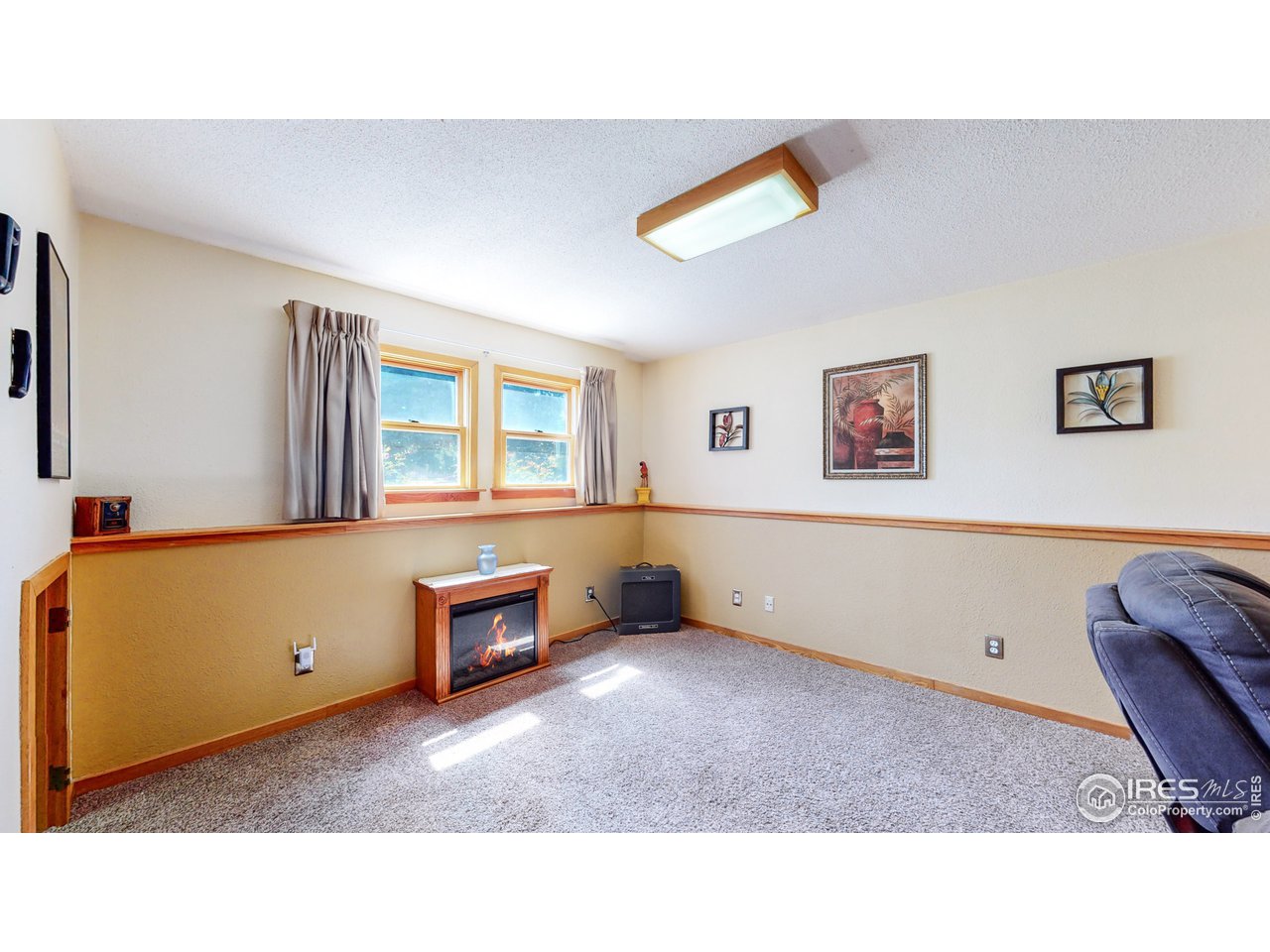 1554 Ervine Avenue Longmont, CO 80501 - Photo 21 of 31 a room with furniture and a window