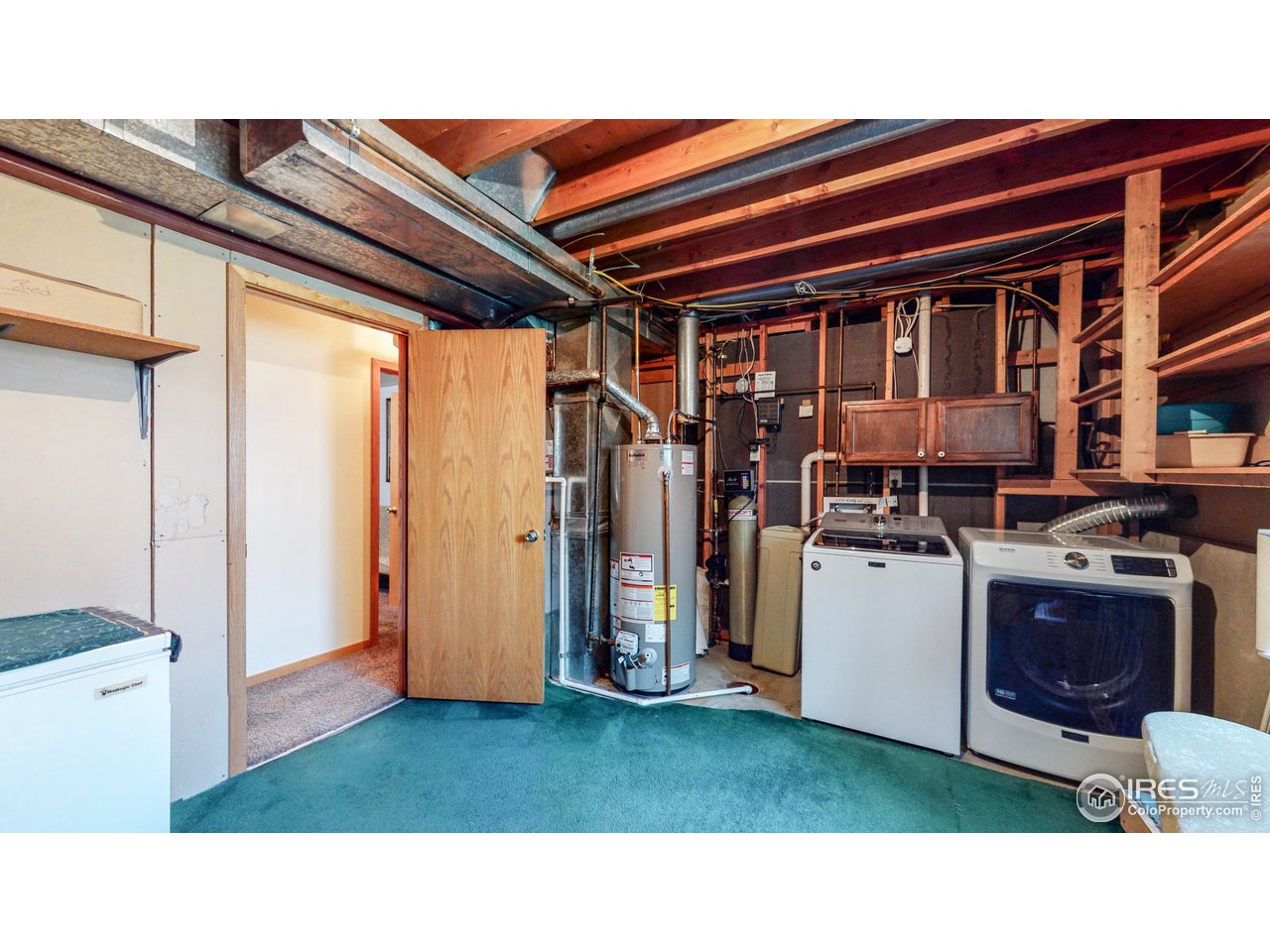 1554 Ervine Avenue Longmont, CO 80501 - Photo 25 of 31 a kitchen with a refrigerator and a stove
