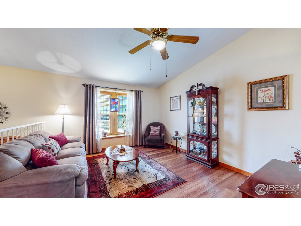 1554 Ervine Avenue Longmont, CO 80501 - Photo 4 of 31 a living room with furniture and a window