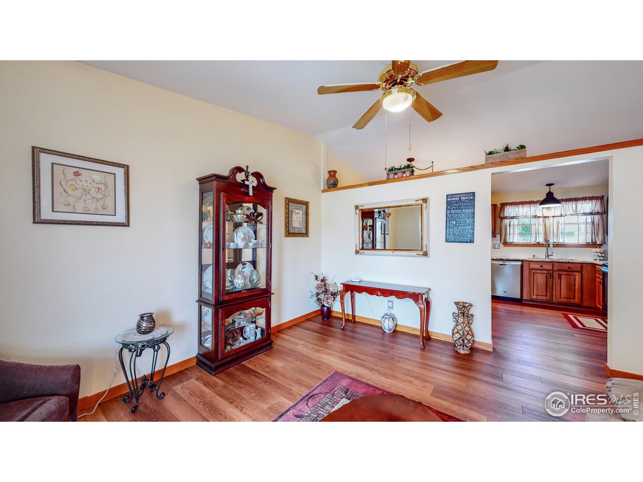 1554 Ervine Avenue Longmont, CO 80501 - Photo 5 of 31 a living room with furniture and a wooden floor