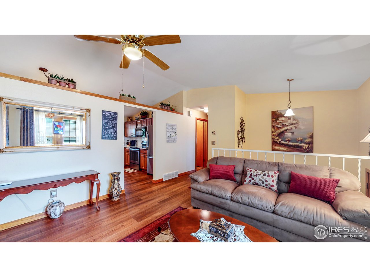 1554 Ervine Avenue Longmont, CO 80501 - Photo 6 of 31 a living room with furniture and wooden floor