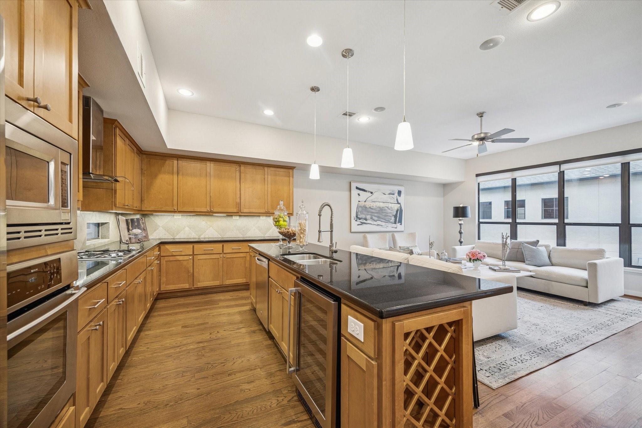 220 Detering Street Houston, TX 77007 - Photo 11 of 27 a kitchen with stainless steel appliances granite countertop a sink and a refrigerator