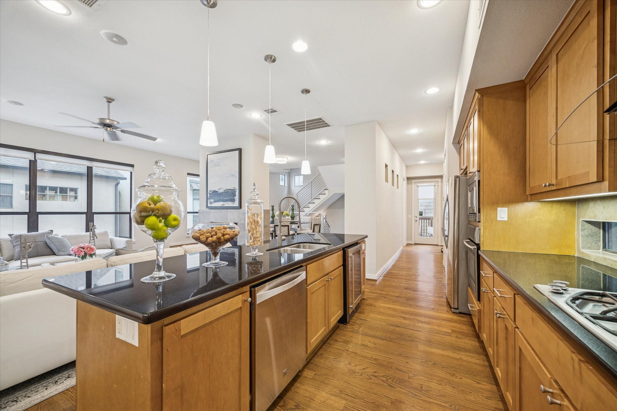 220 Detering Street Houston, TX 77007 - Photo 12 of 27 a kitchen with stainless steel appliances granite countertop a sink and cabinets