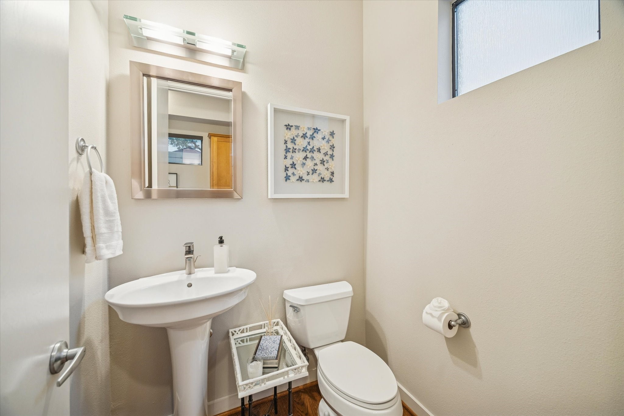 220 Detering Street Houston, TX 77007 - Photo 15 of 27 a bathroom with a toilet sink and mirror