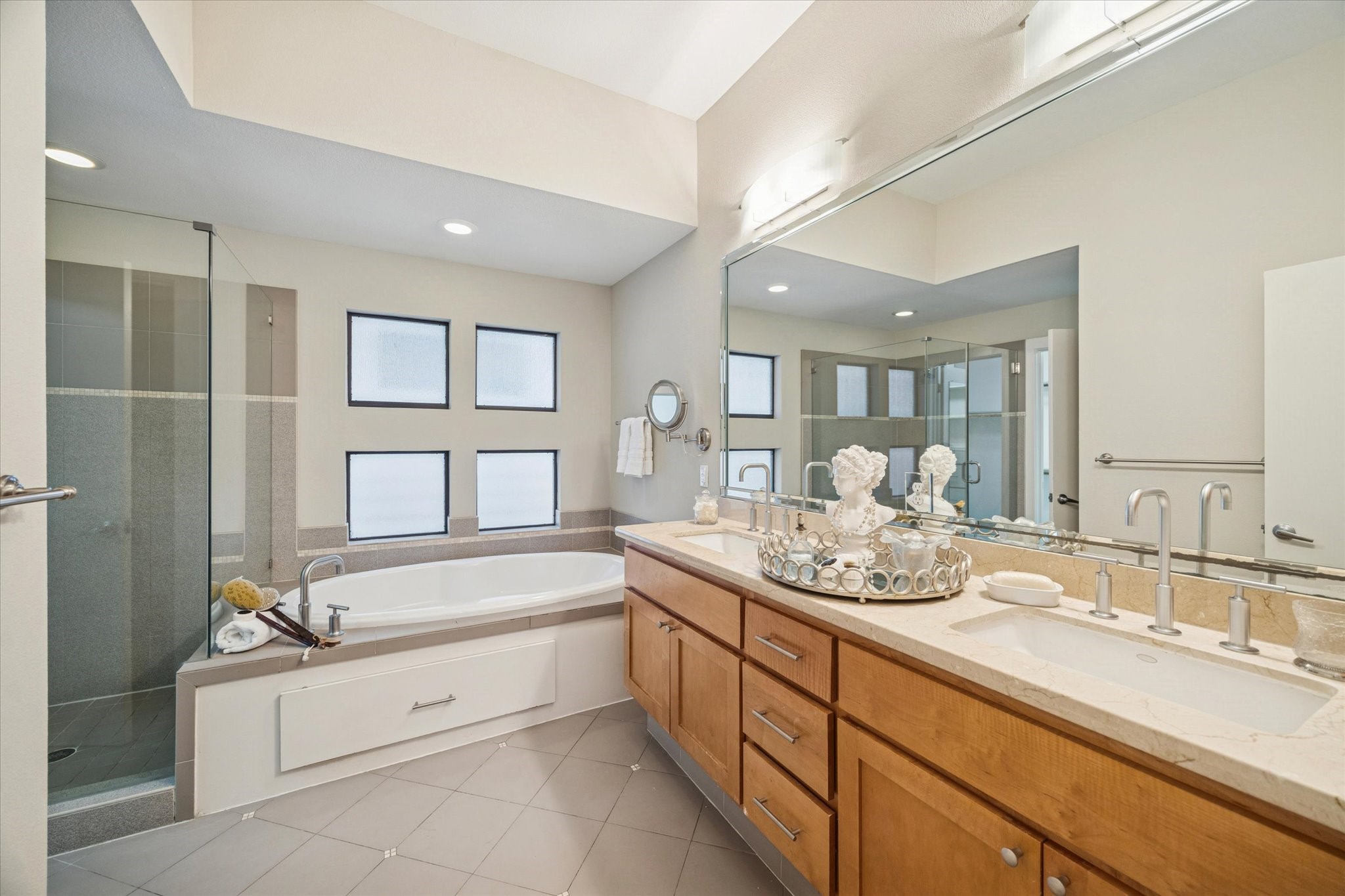 220 Detering Street Houston, TX 77007 - Photo 18 of 27 a spacious bathroom with a granite countertop tub sink and mirror