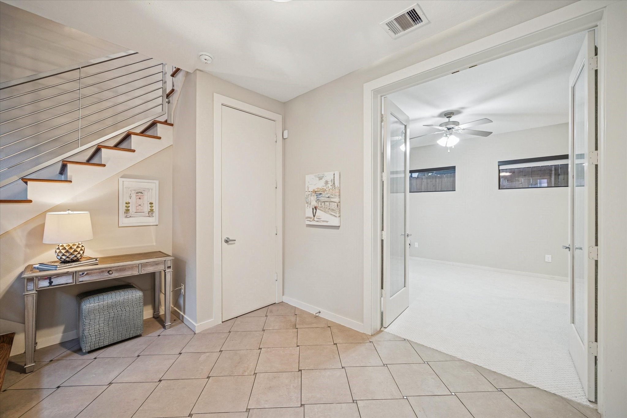 220 Detering Street Houston, TX 77007 - Photo 3 of 27 a view of an empty room with cabinet and a fireplace