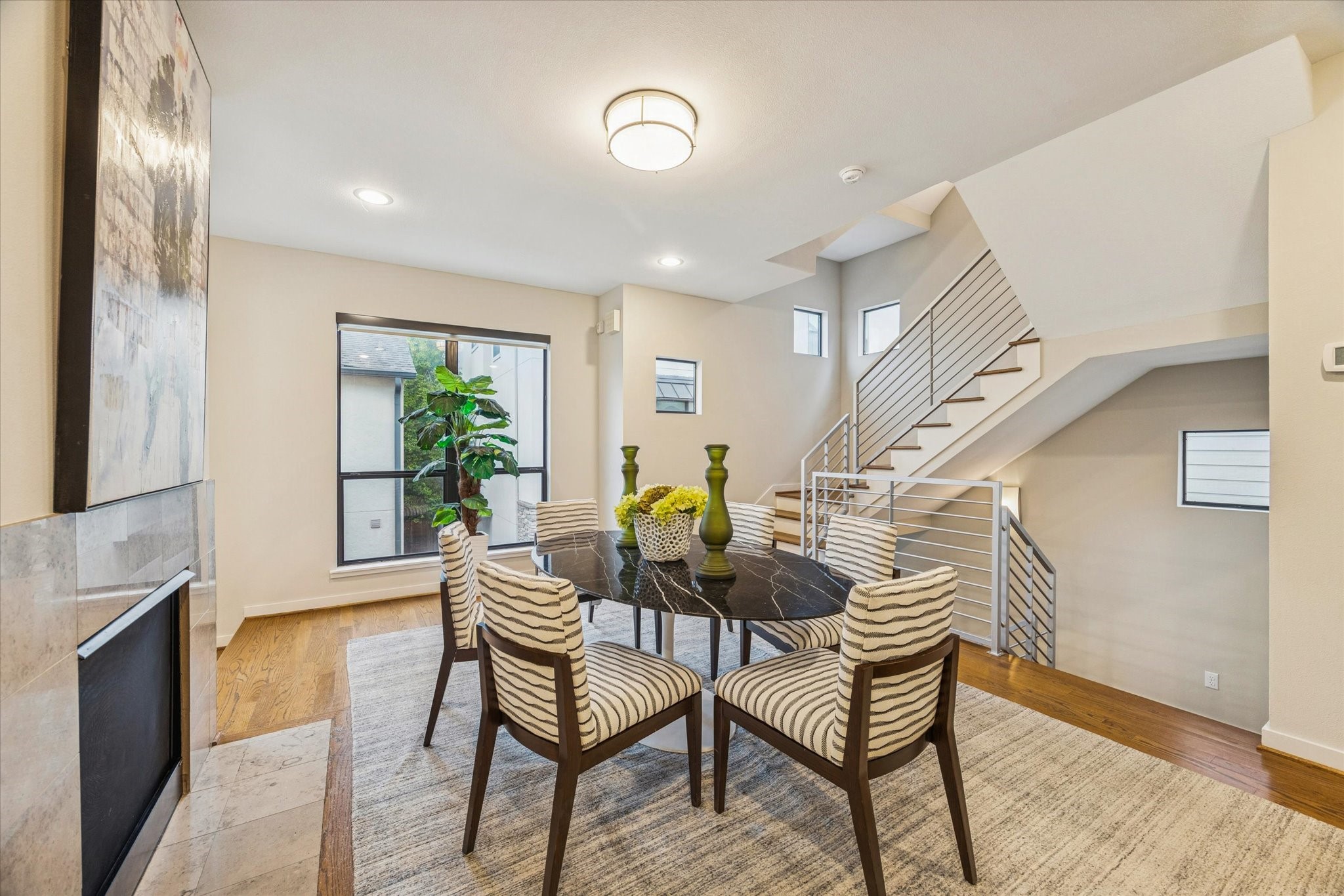 220 Detering Street Houston, TX 77007 - Photo 5 of 27 a dining room with furniture and a chandelier
