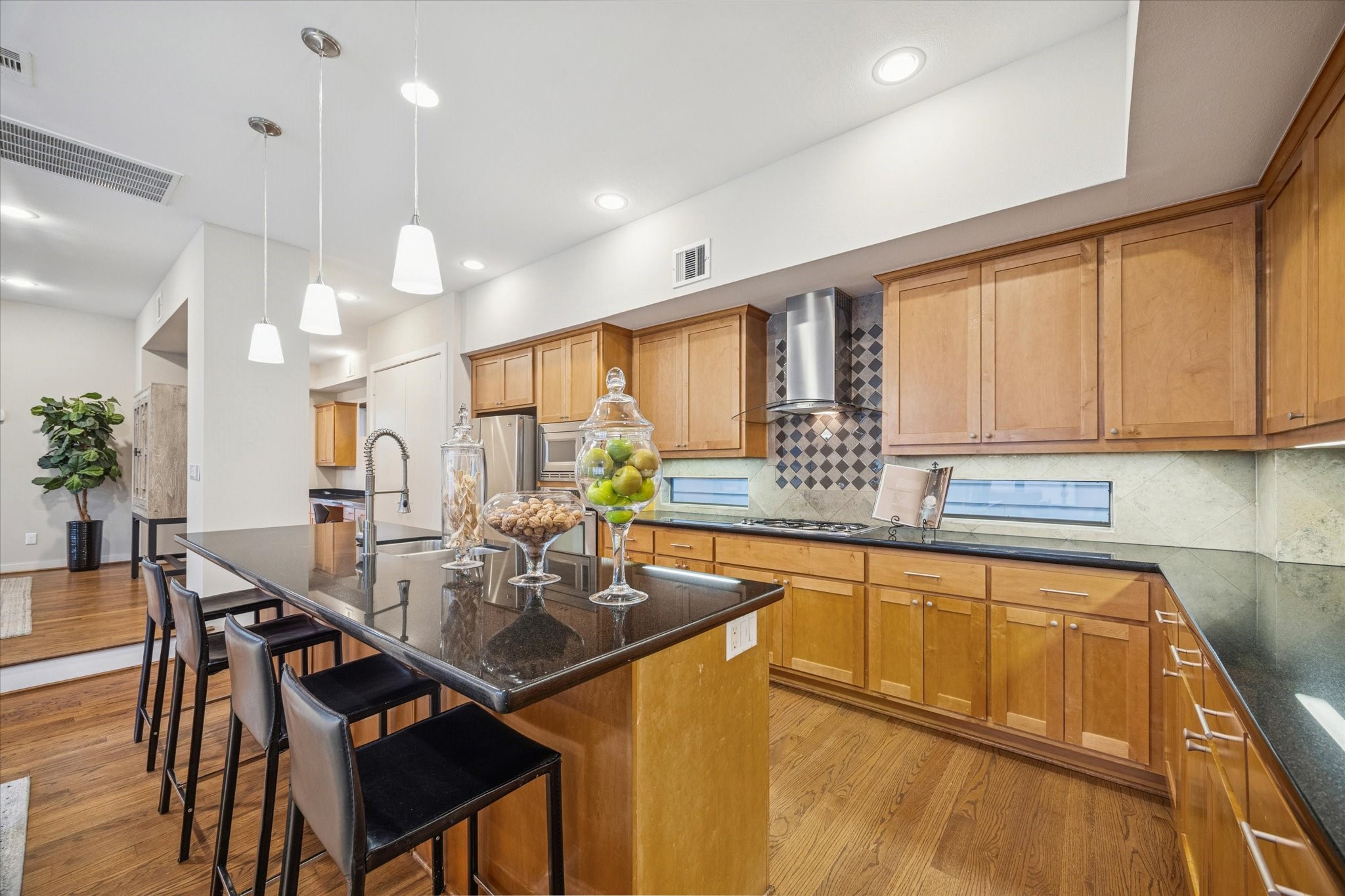 220 Detering Street Houston, TX 77007 - Photo 9 of 27 a kitchen with a table chairs stove and cabinets