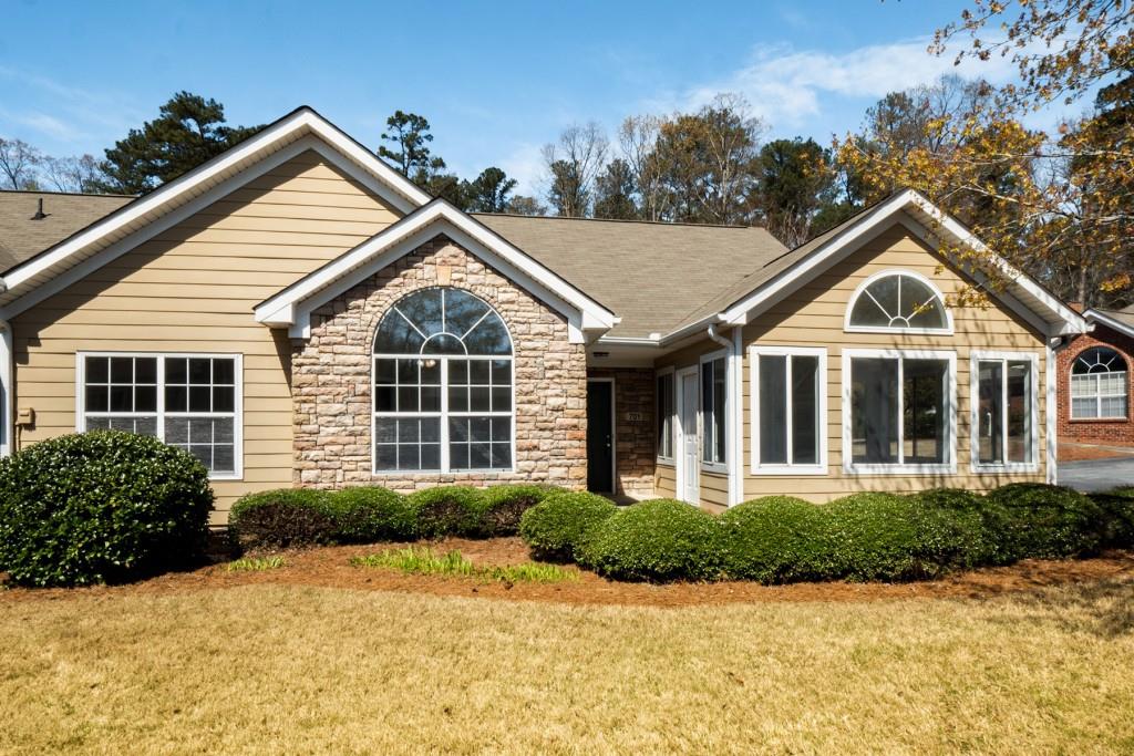 a front view of a house with a yard