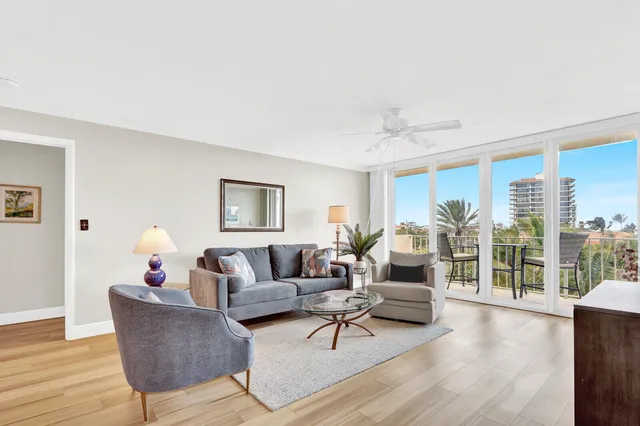 a bedroom with two beds and a lamp on table