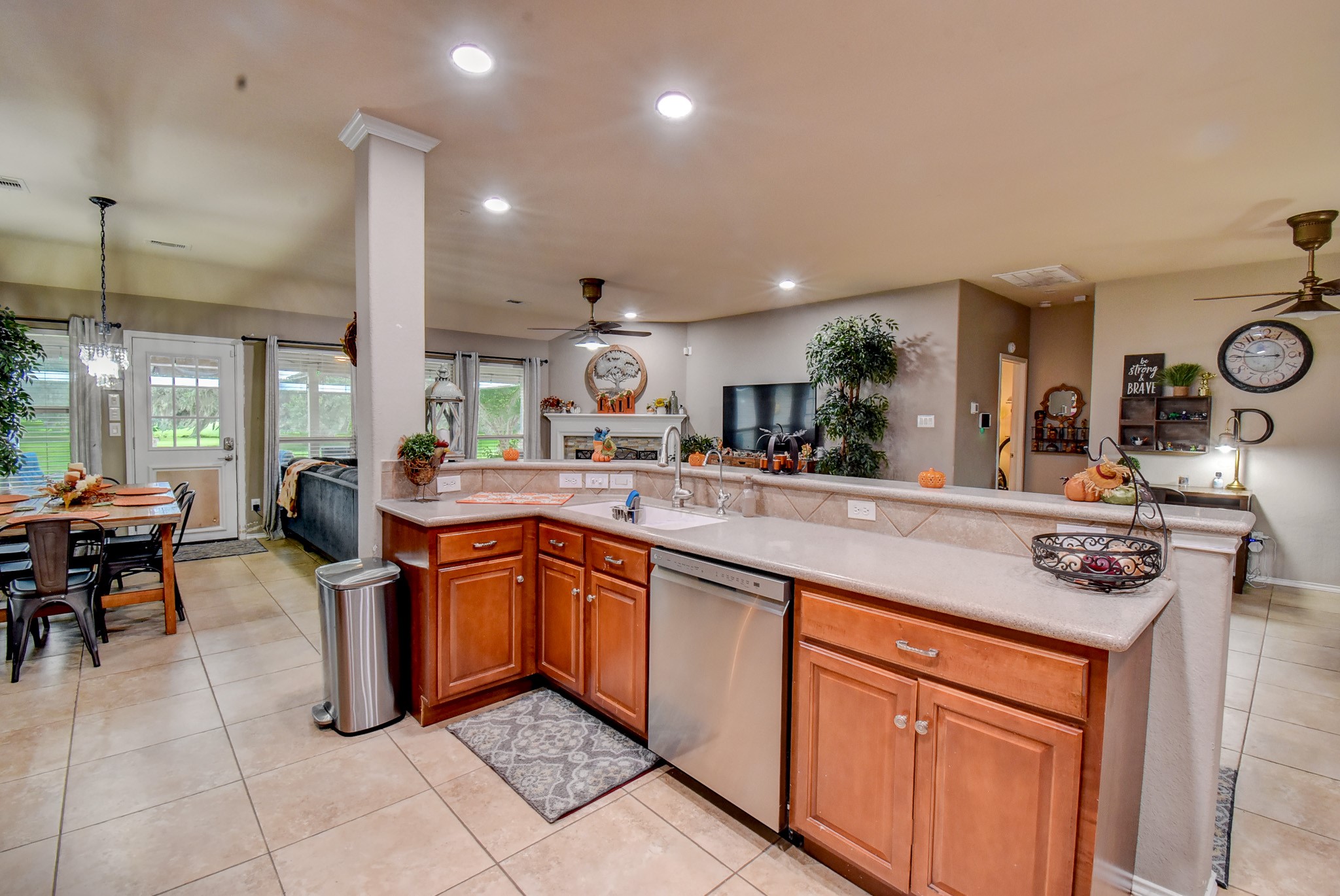 838 County Road 968 A Angleton, TX 77515 - Photo 16 of 49 a kitchen with stainless steel appliances granite countertop a sink and a refrigerator
