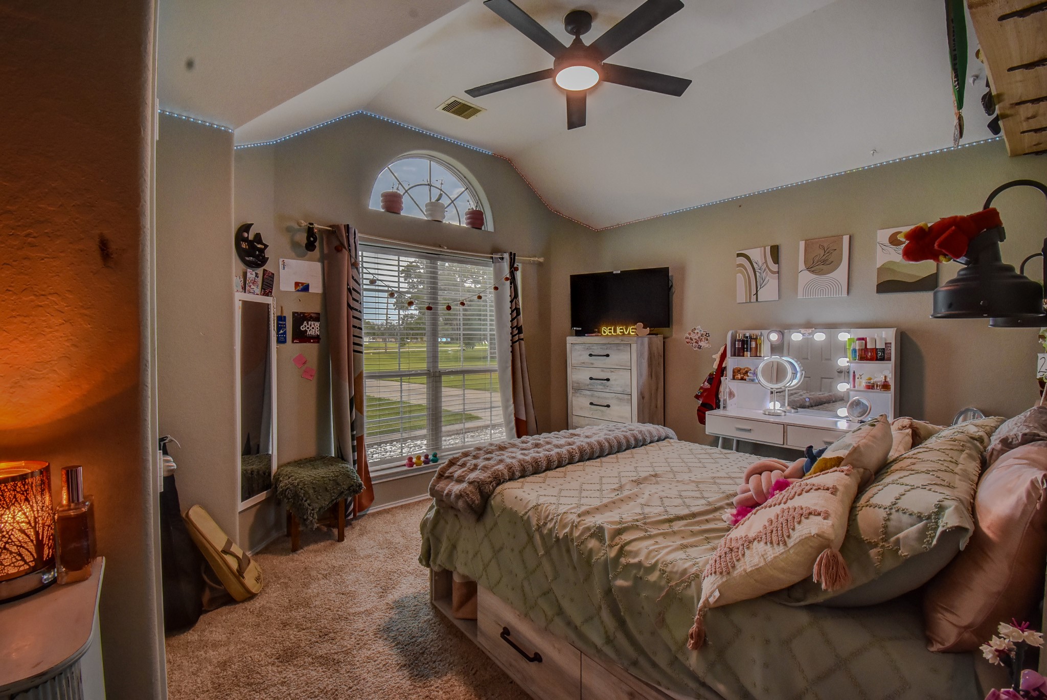 838 County Road 968 A Angleton, TX 77515 - Photo 31 of 49 a bedroom with a bed a ceiling fan and a large window