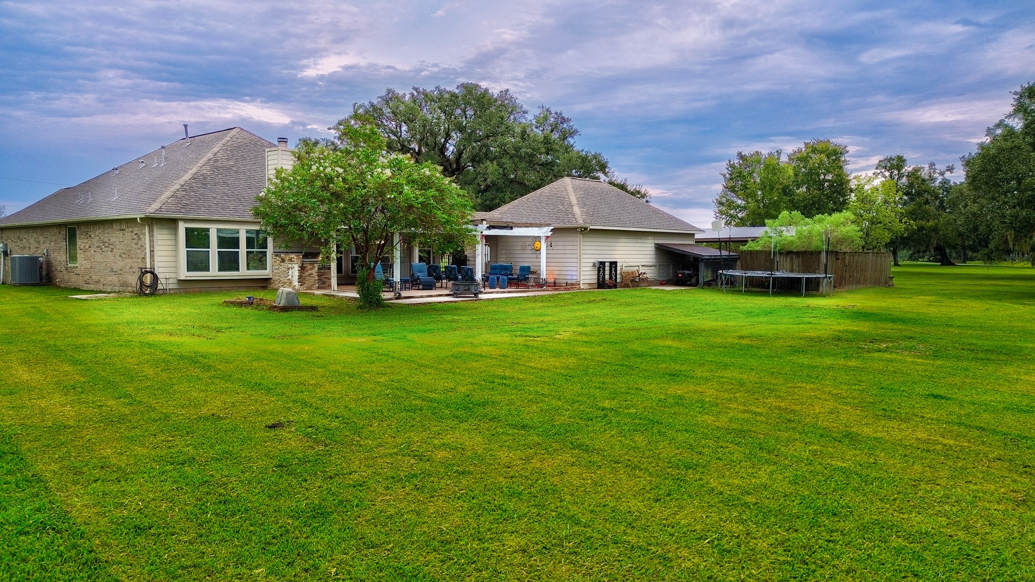 838 County Road 968 A Angleton, TX 77515 - Photo 37 of 49 a view of a house with a yard and sitting area