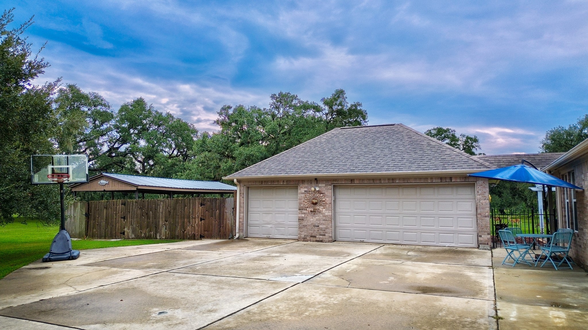 838 County Road 968 A Angleton, TX 77515 - Photo 4 of 49 a front view of a house with a yard and garage