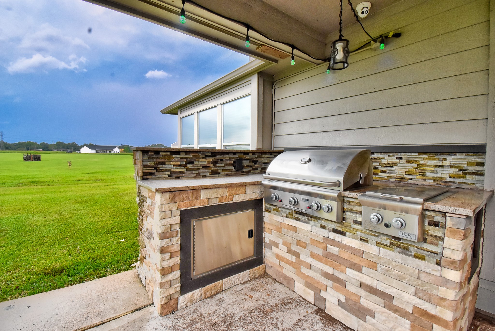 838 County Road 968 A Angleton, TX 77515 - Photo 5 of 49 a view of a fireplace with an outdoor space