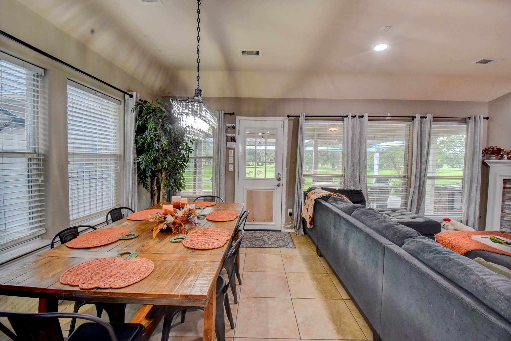 838 County Road 968 A Angleton, TX 77515 - Photo 9 of 49 a living room with furniture and large windows