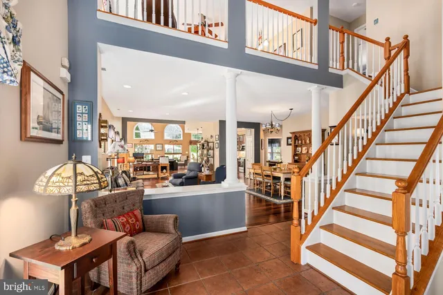 a view of a livingroom with furniture and a floor to ceiling window