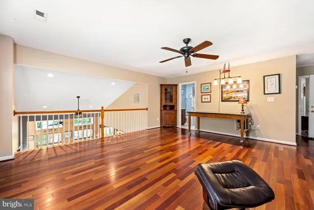 a room with furniture and wooden floor