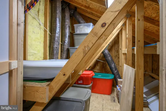 a room with wooden floor and stairs